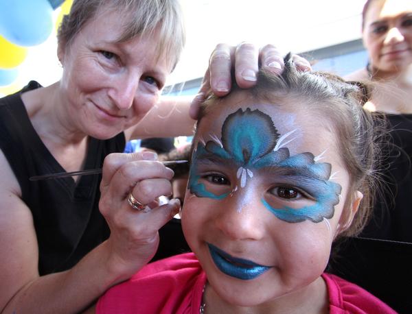 6 yr old Mich Totorewa has her face painted at footsteps Kids Day Out 